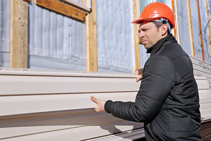 Skilled siding professionals at work